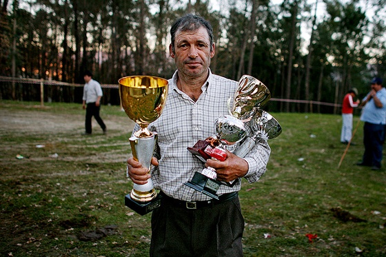 man with trophy