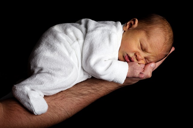 Sleeping Baby balance on an arm